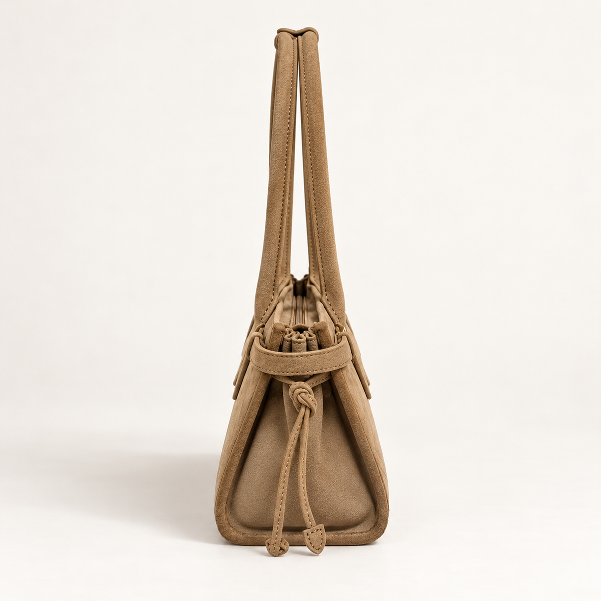 RANI Amara Oat nubuck suede bag, side view with folded gusset and leather ties