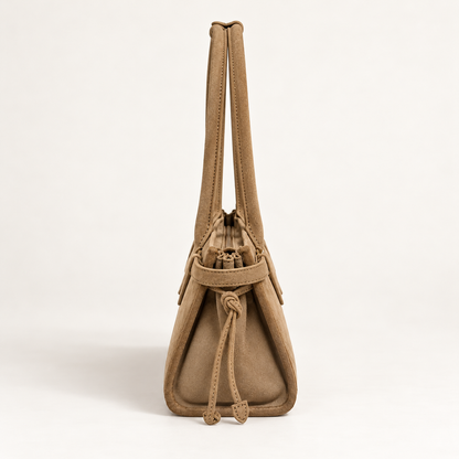 RANI Amara Oat nubuck suede bag, side view with folded gusset and leather ties
